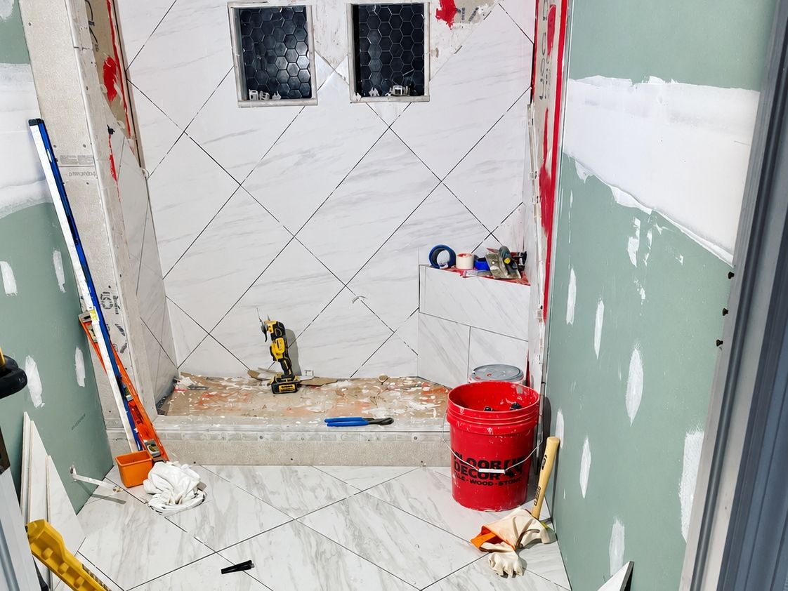 Small bathroom with large white diagonal-pattern porcelain floor tile
